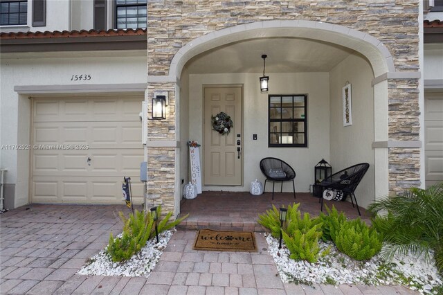 entrance to property featuring a garage