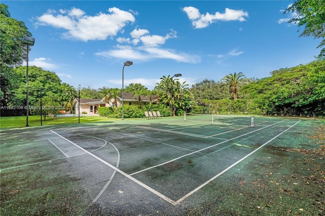 view of sport court with fence