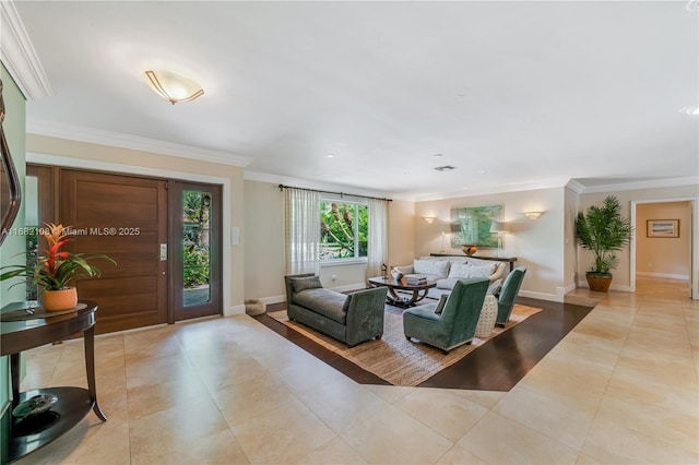 living room featuring crown molding, baseboards, and light tile patterned floors