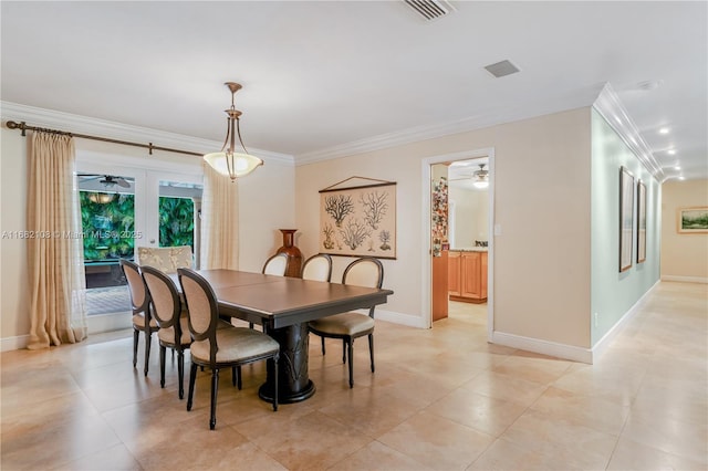 dining room featuring baseboards, french doors, visible vents, and crown molding