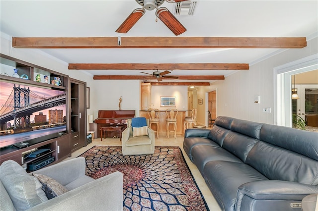 living area with carpet floors, beamed ceiling, visible vents, and a ceiling fan