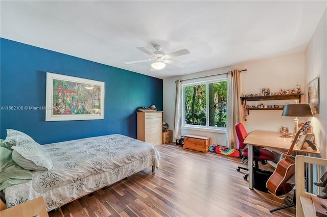 bedroom with a ceiling fan and wood finished floors