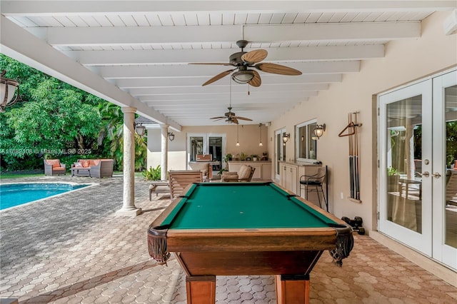 rec room with a ceiling fan, french doors, pool table, and beamed ceiling