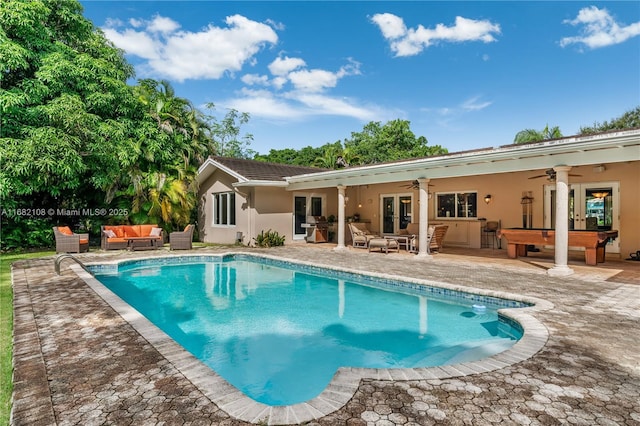 rear view of property with french doors, stucco siding, an outdoor hangout area, ceiling fan, and an outdoor pool