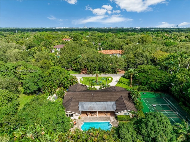 drone / aerial view featuring a view of trees