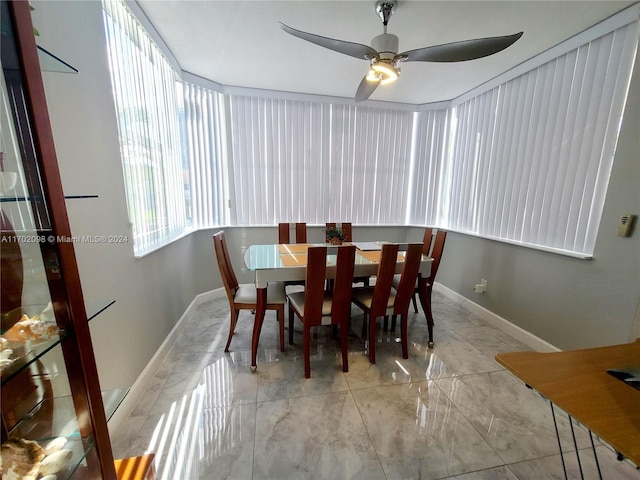 dining space featuring ceiling fan