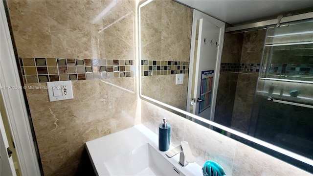 bathroom with vanity and tile walls