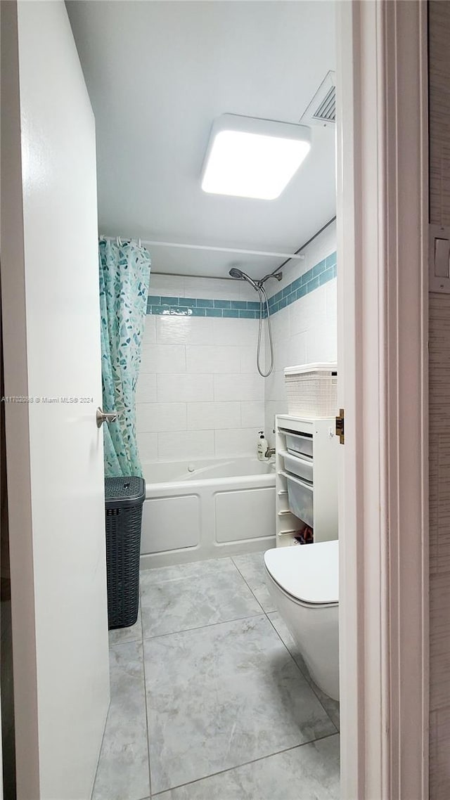 bathroom with toilet and shower / bathtub combination with curtain