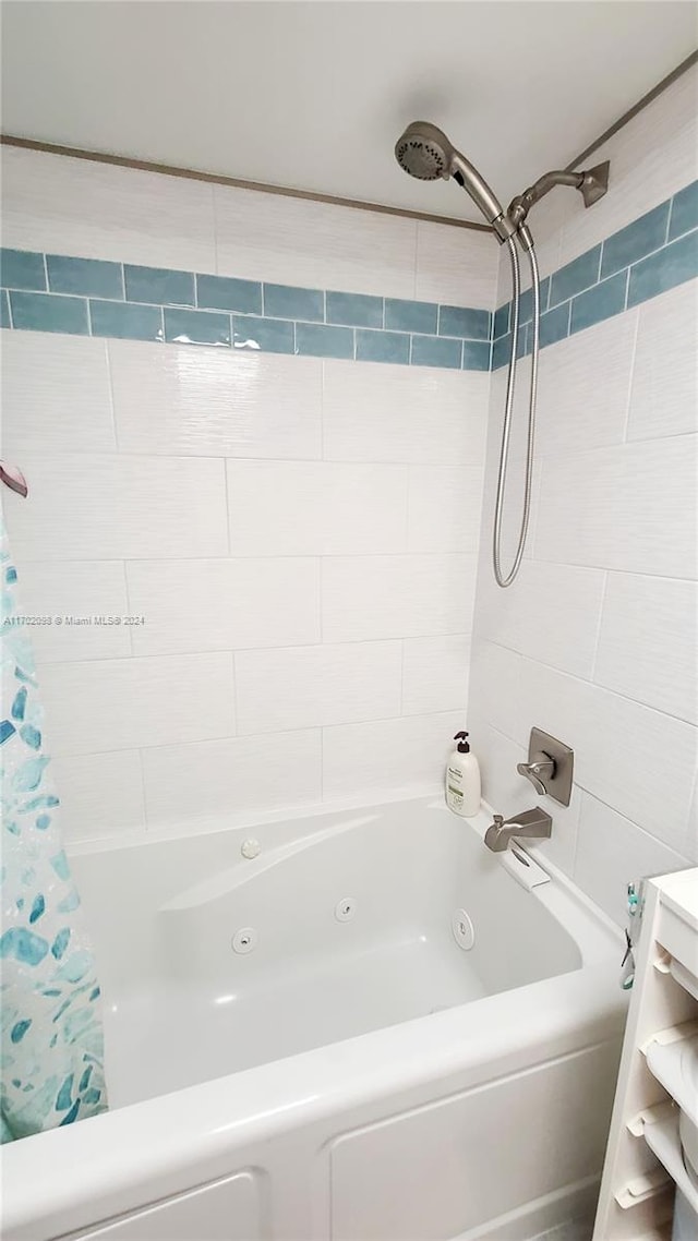 bathroom with shower / bathtub combination with curtain