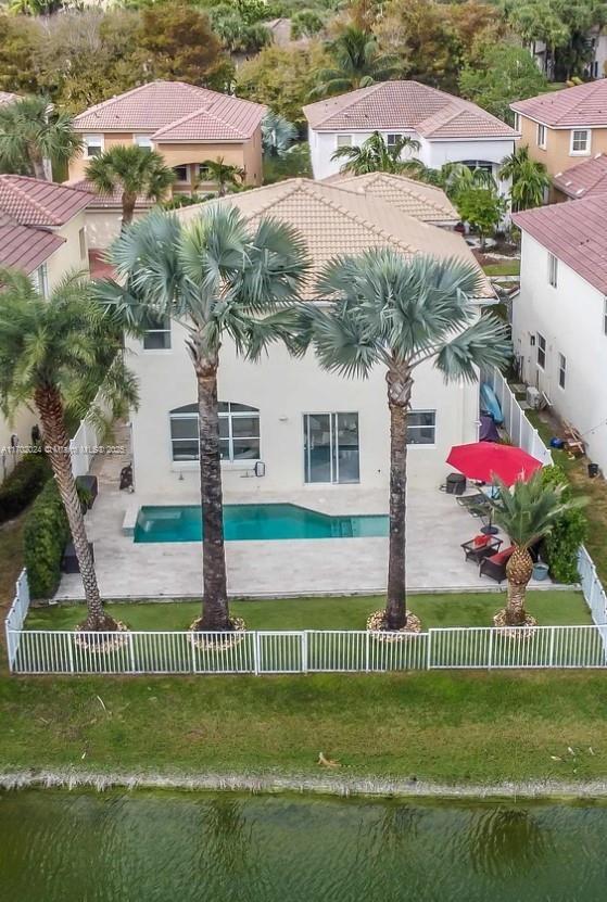 birds eye view of property with a water view