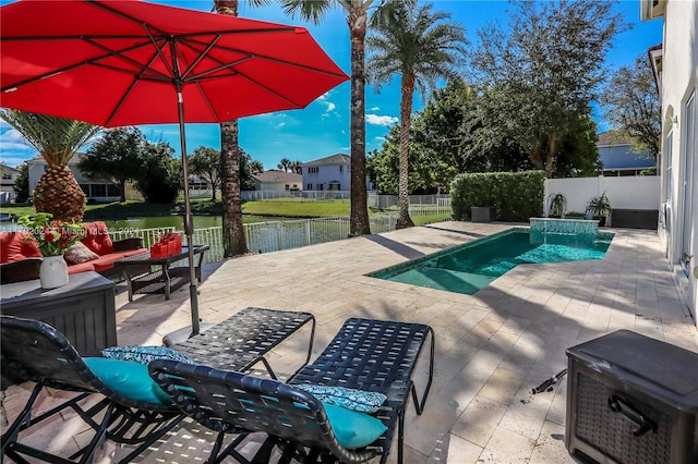 view of pool featuring an outdoor living space, a water view, and a patio