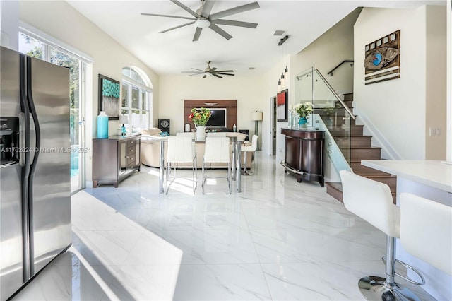 interior space with ceiling fan