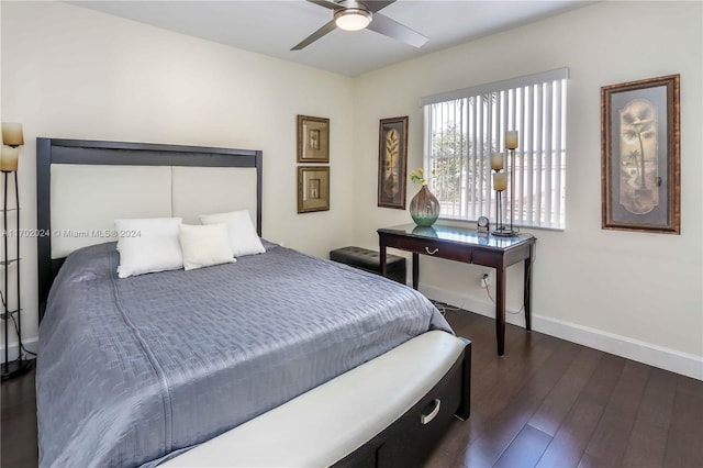 bedroom with ceiling fan and dark wood-type flooring