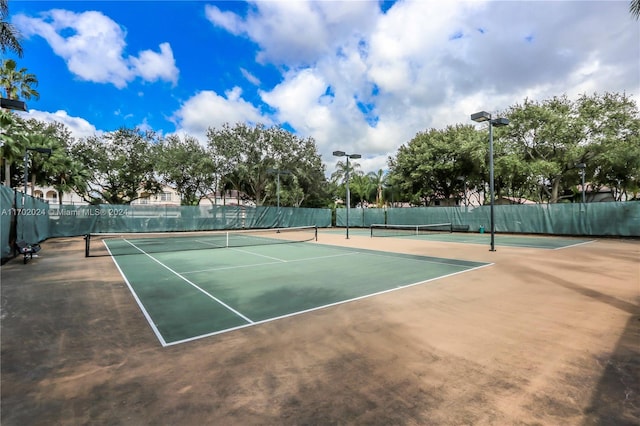 view of sport court with basketball hoop