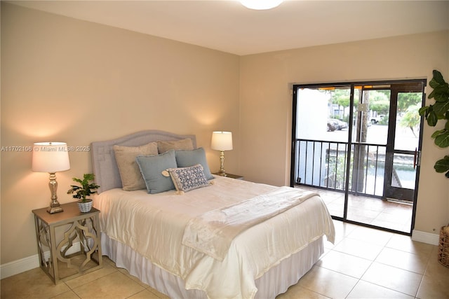 bedroom with light tile patterned floors, baseboards, and access to exterior