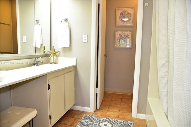 full bathroom featuring baseboards, shower / bathtub combination with curtain, vanity, and tile patterned floors