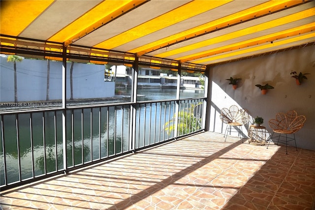 exterior space with a water view and a balcony