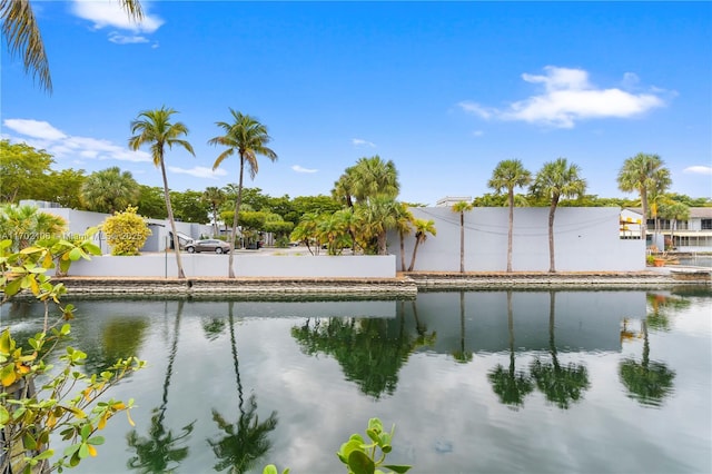 property view of water featuring fence