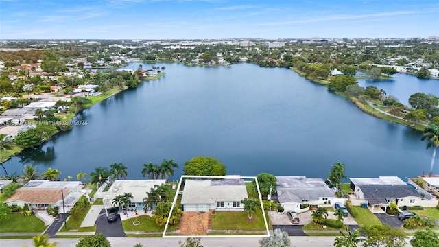 drone / aerial view with a water view