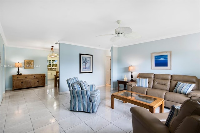 living room featuring crown molding, light tile patterned floors, and ceiling fan