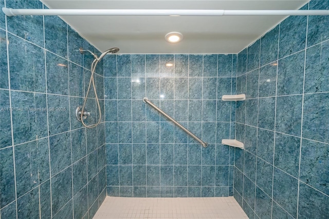 bathroom with tiled shower