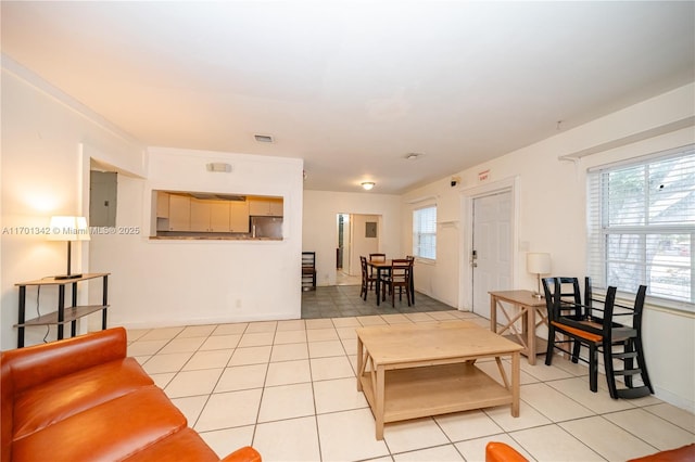 living room with electric panel and light tile patterned floors