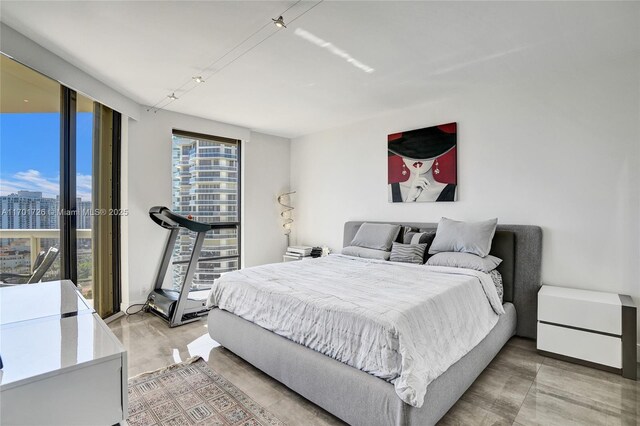 20191 E Country Club Dr Unit 2310, Aventura, FL 33180 - bedroom featuring a city view and light wood-type flooring