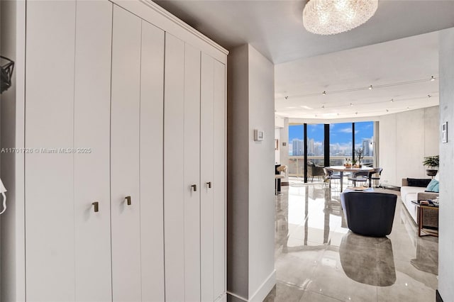 20191 E Country Club Dr Unit 2310, Aventura, FL 33180 - hallway featuring tile patterned floors and expansive windows