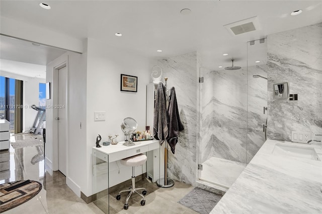 bathroom featuring vanity, concrete flooring, tile walls, and walk in shower