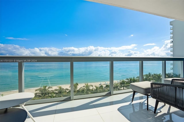 balcony with a view of the beach and a water view