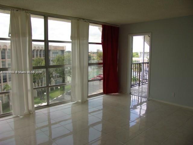 spare room with tile patterned flooring