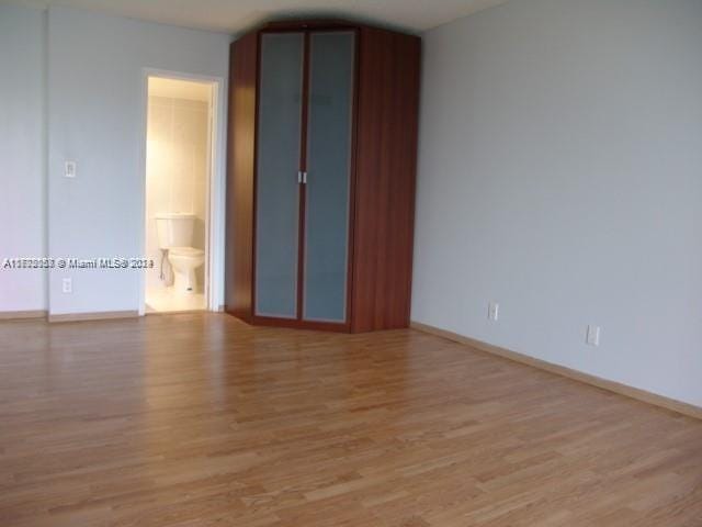 unfurnished room featuring light hardwood / wood-style floors