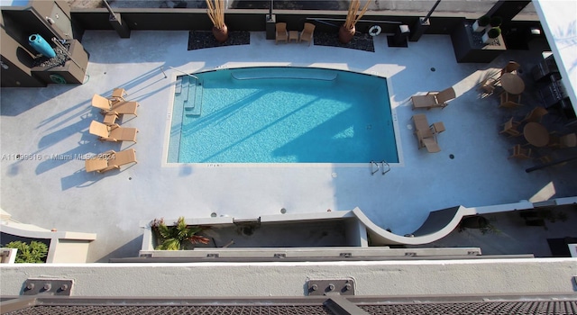 view of pool featuring a jacuzzi