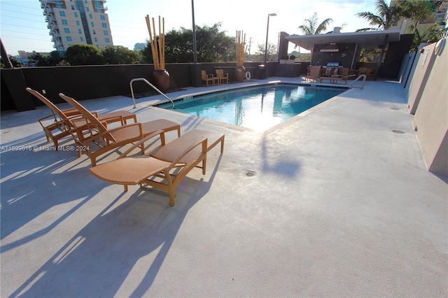 view of swimming pool featuring a patio area