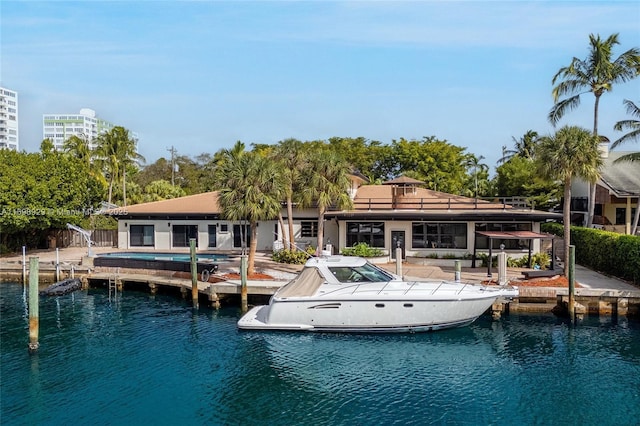 back of house featuring a water view