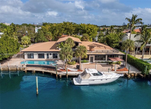 2010 NE 120th Rd, North Miami, FL 33181 - back of property with a patio and an outdoor pool