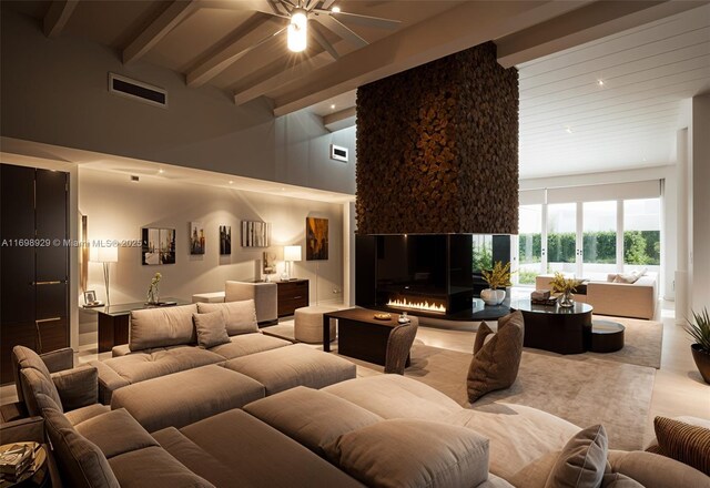 2010 NE 120th Rd, North Miami, FL 33181 - home theater room with beamed ceiling, a towering ceiling, and a ceiling fan