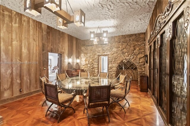2010 NE 120th Rd, North Miami, FL 33181 - dining space with wooden walls and a chandelier
