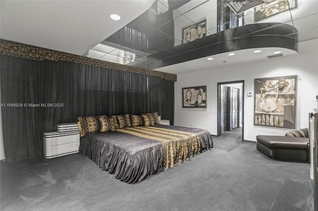 carpeted bedroom featuring a high ceiling