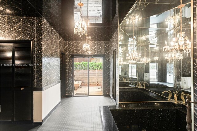 2010 NE 120th Rd, North Miami, FL 33181 - bathroom with a chandelier
