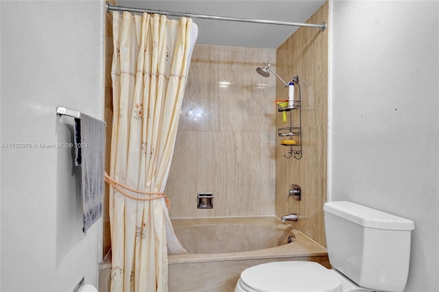 bathroom featuring shower / bath combination with curtain and toilet