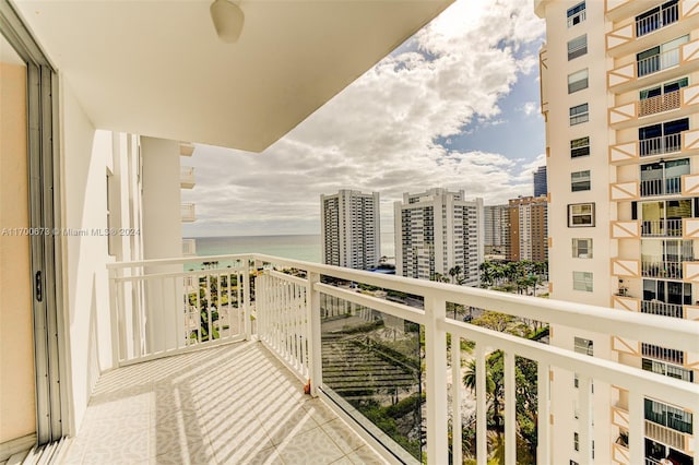 balcony featuring a water view