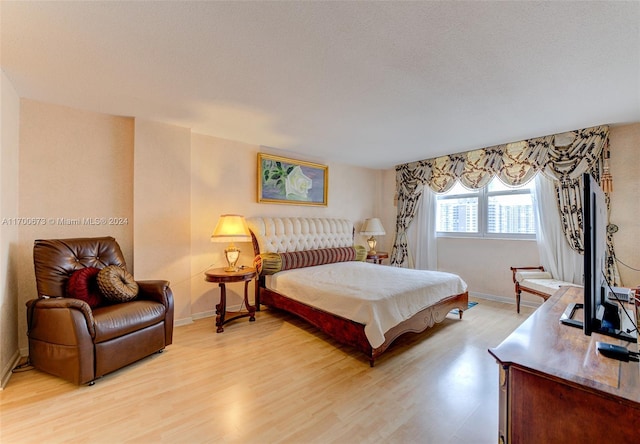 bedroom with light hardwood / wood-style floors