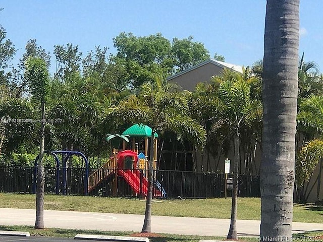 view of play area featuring a lawn