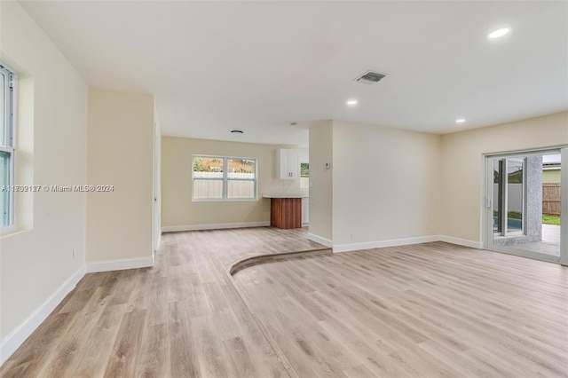 unfurnished living room with light hardwood / wood-style flooring