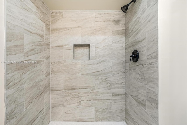 bathroom with tiled shower