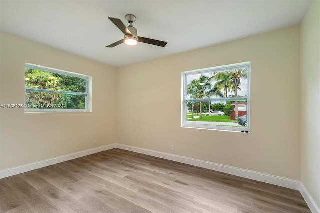 unfurnished room with ceiling fan and light hardwood / wood-style flooring