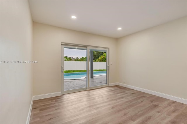 unfurnished room featuring light wood-type flooring