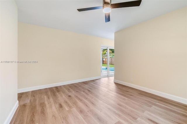 empty room featuring ceiling fan and light hardwood / wood-style flooring