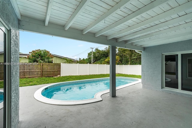 view of swimming pool with a patio